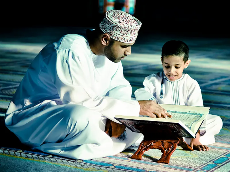 Boy reading Quran